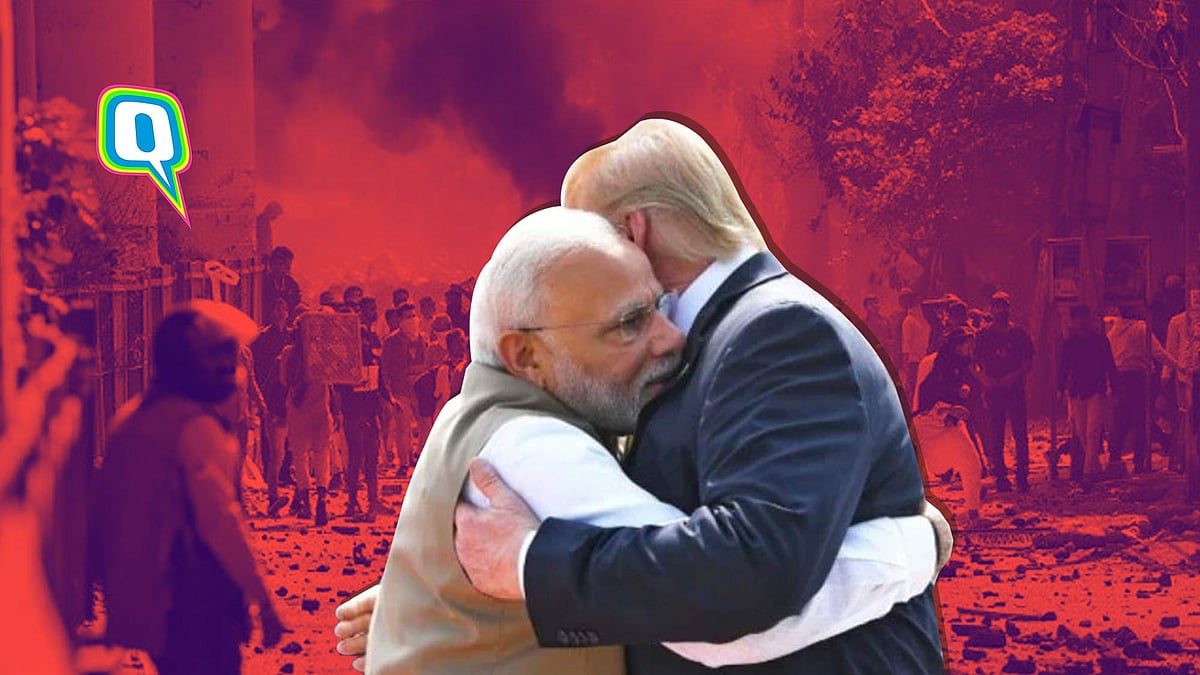 PM Modi and US President Donald Trump embrace, meanwhile the city burns.