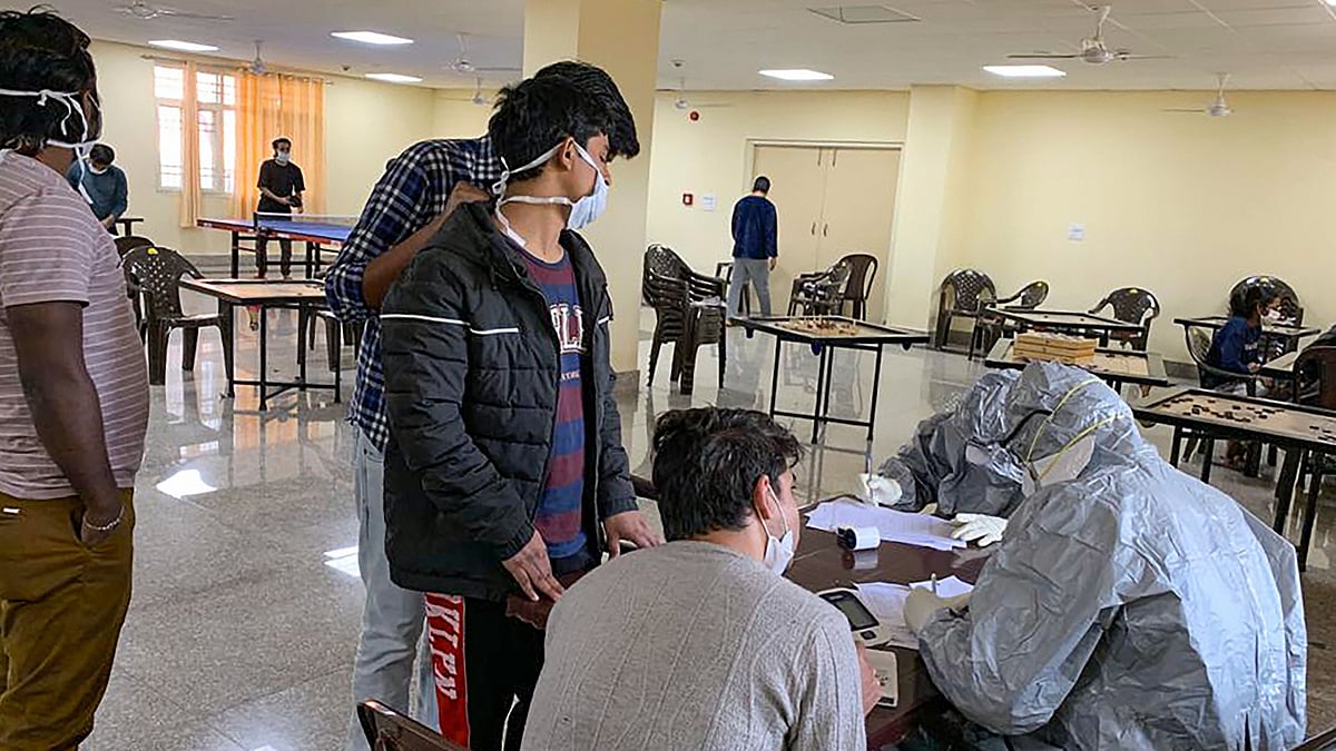 Indian nationals undergo screening at a quarantine facility set by up ITBP, at Chhawla area in New Delhi.