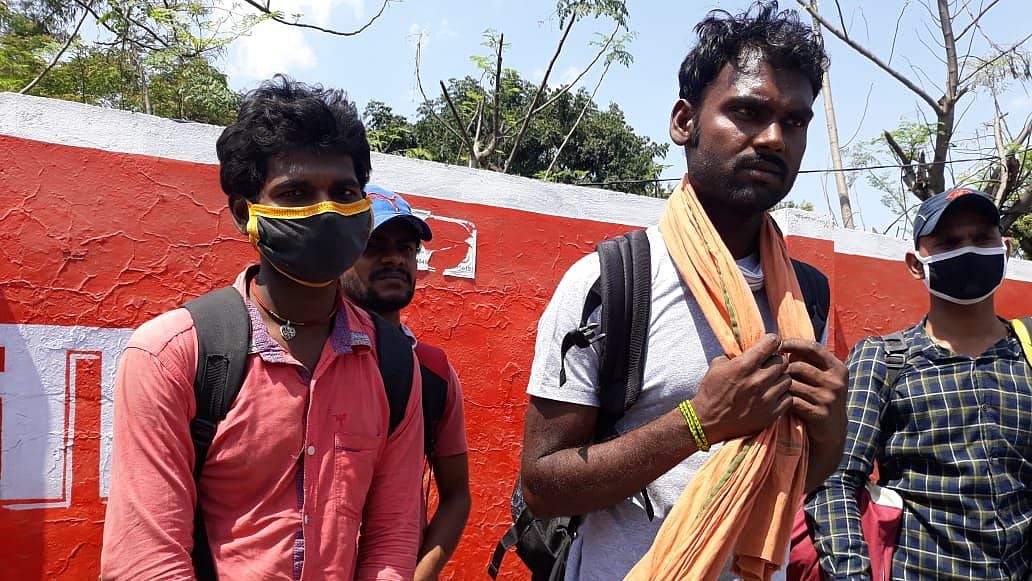 Labourers waiting in Ranchi for a bus to go back to their homes.