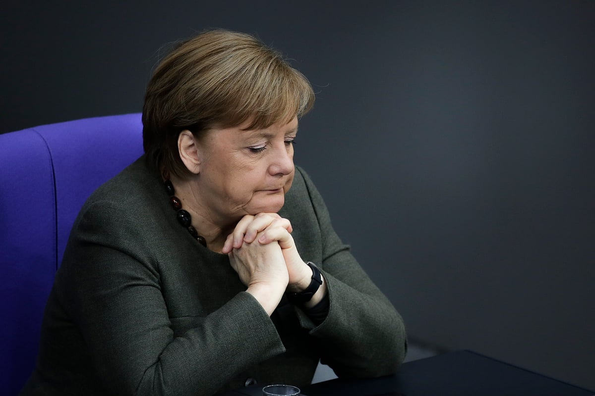 German Chancellor Angela Merkel extended her hand for a handshake to a man, who refused to shake it. Merkel laughed and waved her hand cheerily at his refusal.