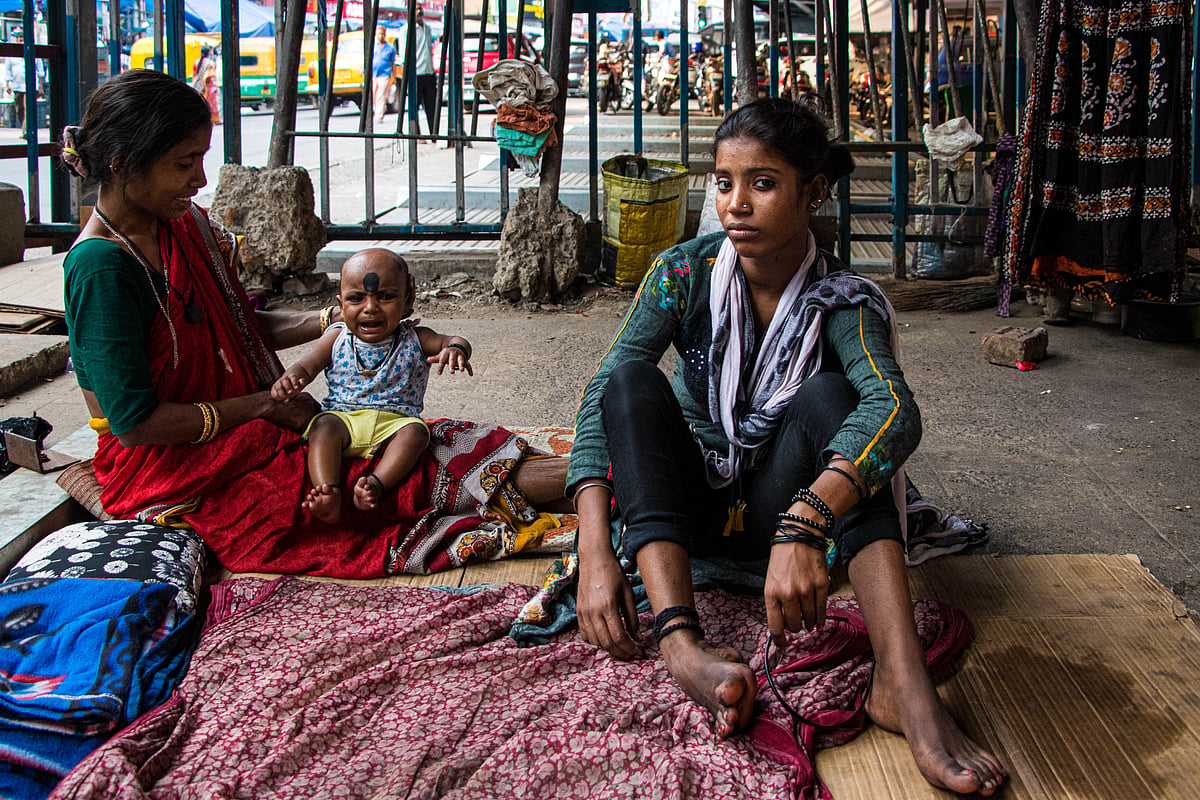 Sabita Sardar, baby, Mampi Mondal under the Gariahat flyover.