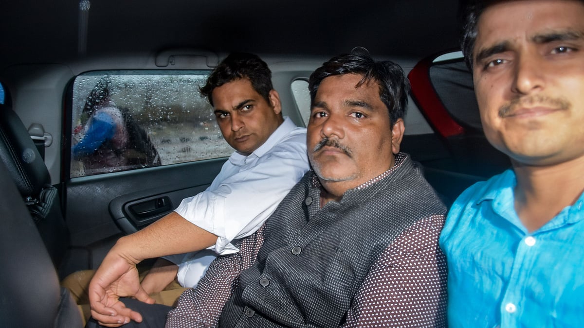 <div class="paragraphs"><p>Former AAP councillor Tahir Hussain (centre).</p></div>