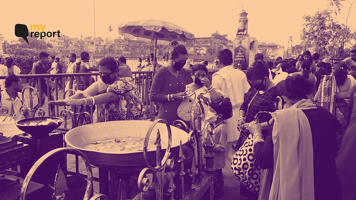 Devotees in Jagannath Temple are visiting with masks on.