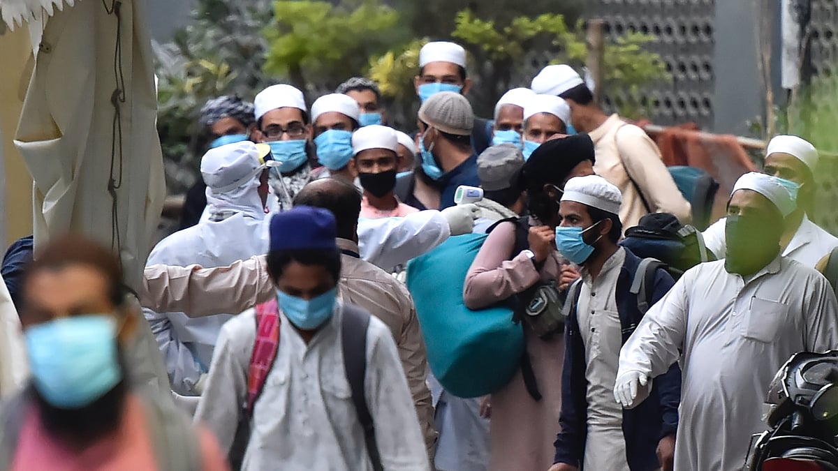 People who showed coronavirus symptoms being taken to various hospitals from Nizamuddin area in New Delhi, Monday,30 March. 