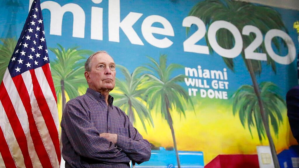In this 3 March photo, Mike Bloomberg waits to speak at a news conference in the Little Havana neighborhood in Miami. 
