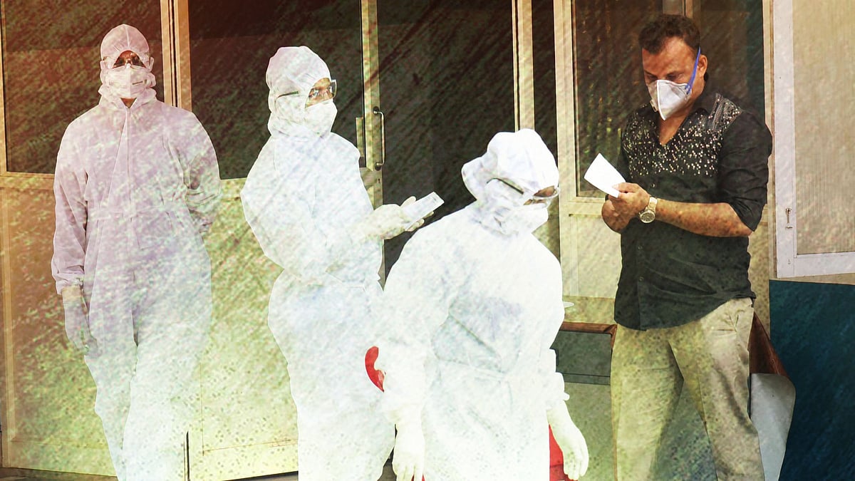 Medical staff members wear masks and protective suits to mitigate the spread of coronavirus, outside the special isolation ward of District Hospital Aluva in Kochi, Thursday, 12 March, 2020. 