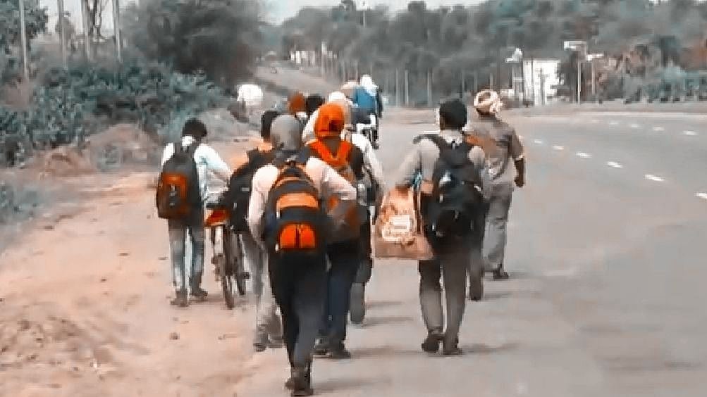 Workers from a factory in Bengal's Howrah, shut because of the corona lockdown, walking to their homes in different states.