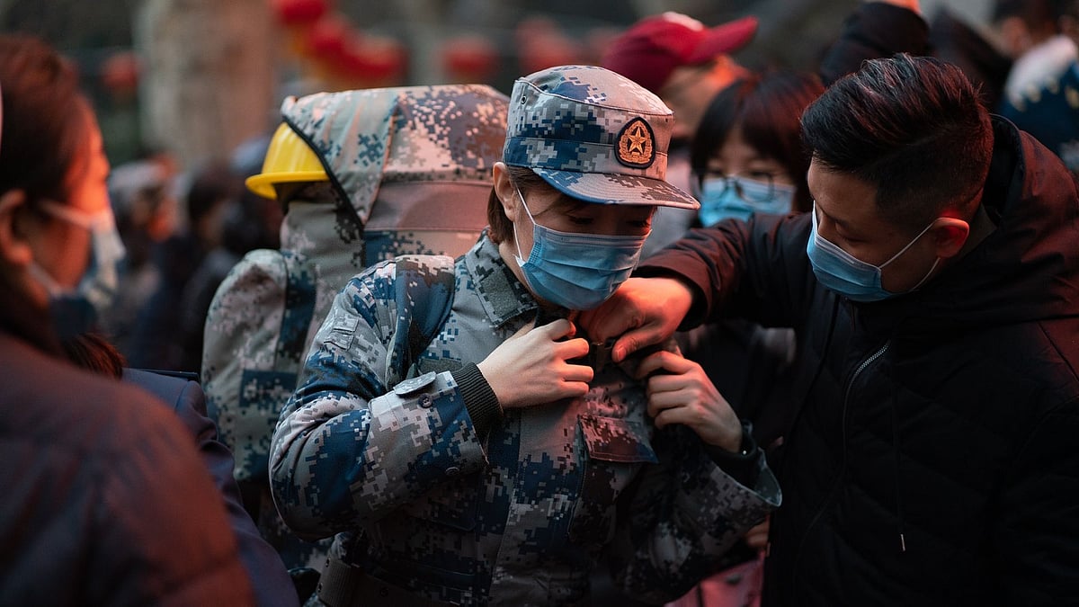 Members of the medical team of the Air Force Medical University say goodbye to their families before rushing to Wuhan to aid the fight against the novel coronavirus outbreak. Image for representation.