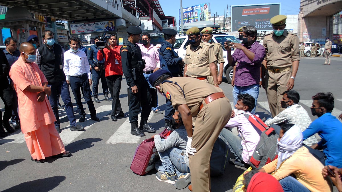 Uttar Pradesh Chief Minister Yogi Adityanath meets migrant workers from various states, during a nationwide lockdown in the wake of coronavirus pandemic, at Awadh Chauraha Alambagh in Lucknow.
