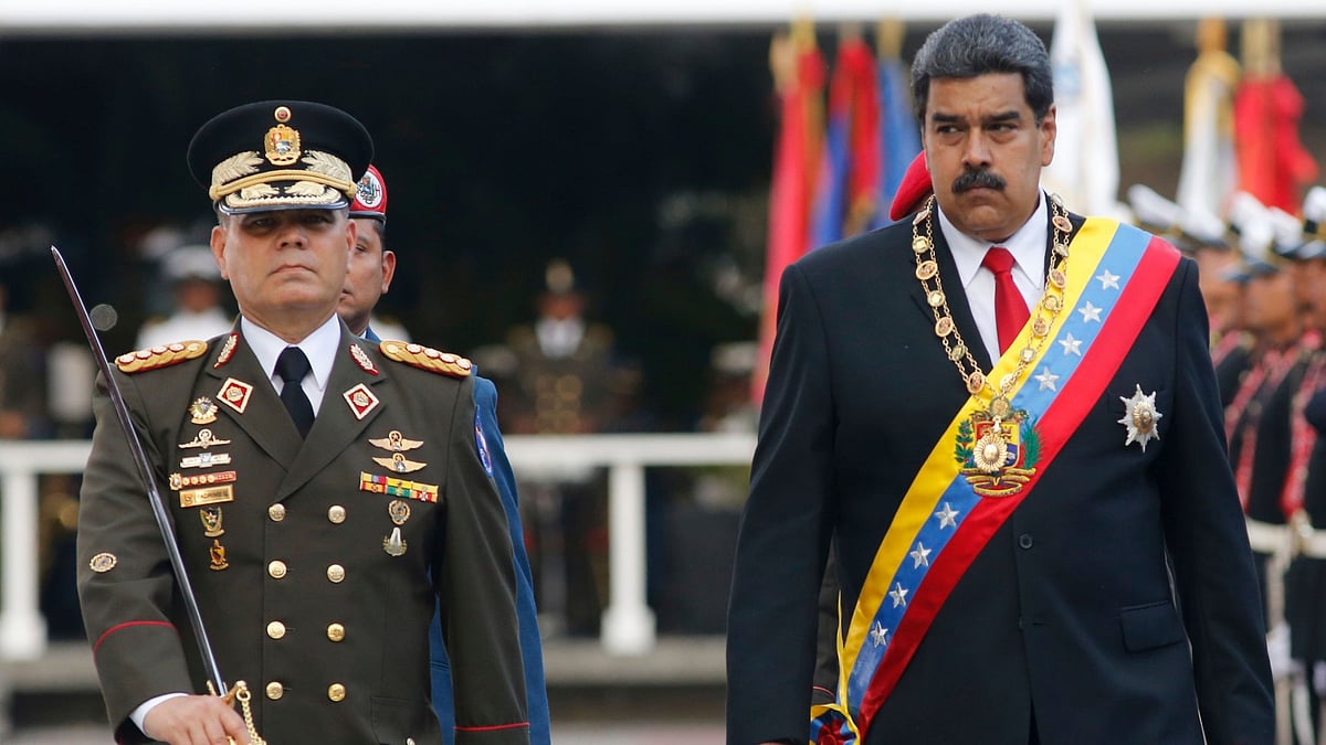 <div class="paragraphs"><p>In this file photo, Venezuela’s President Nicolas Maduro, right, walks with his Defence Minister Vladimir Padrino Lopez as they review the troops during a military parade at Fort Tiuna in Caracas, Venezuela.</p></div>
