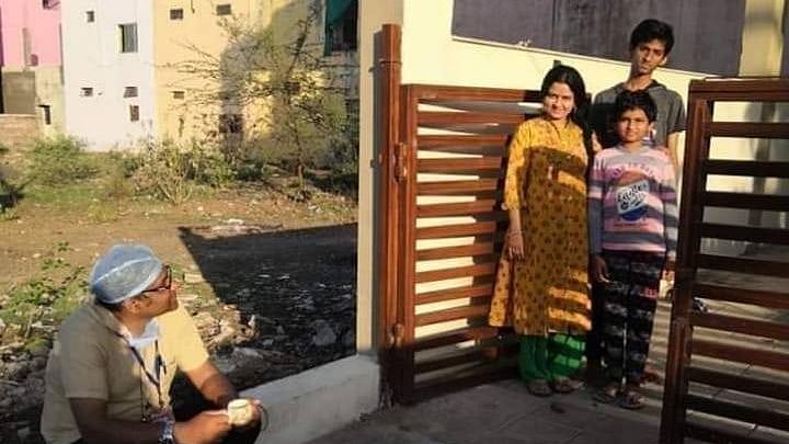 Dr Sudhir having tea with his family.