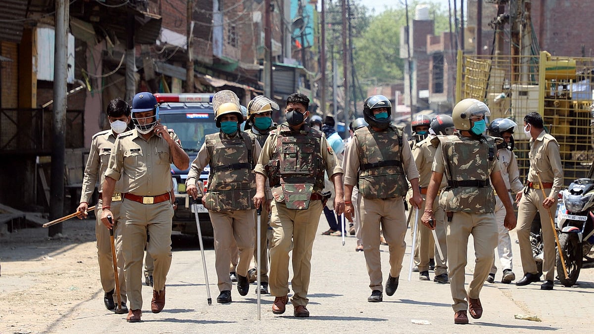 Security personnel patrolling the area in Aligarh where clashes broke out between locals and policemen. 