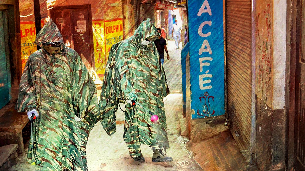 CRPF personnel wearing protective outfits sanitize a street near Dasaswamedh Ghat during ongoing COVID-19 lockdown in Varanasi, Tuesday, 21 April, 2020. Image used for representation.