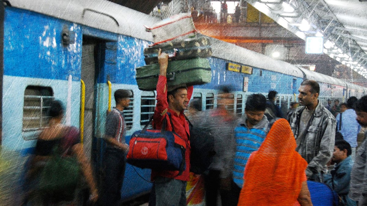 A porter carrying luggage at a Delhi railway station. 