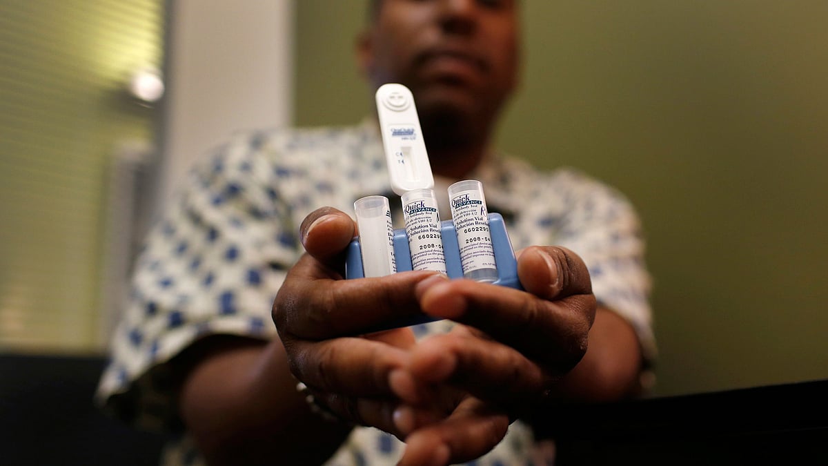IN this representational picture, a staff member at the AIDS Service Center of New York City holds an OraQuick Advance Rapid HIV-1/2 Antibody test kit. 