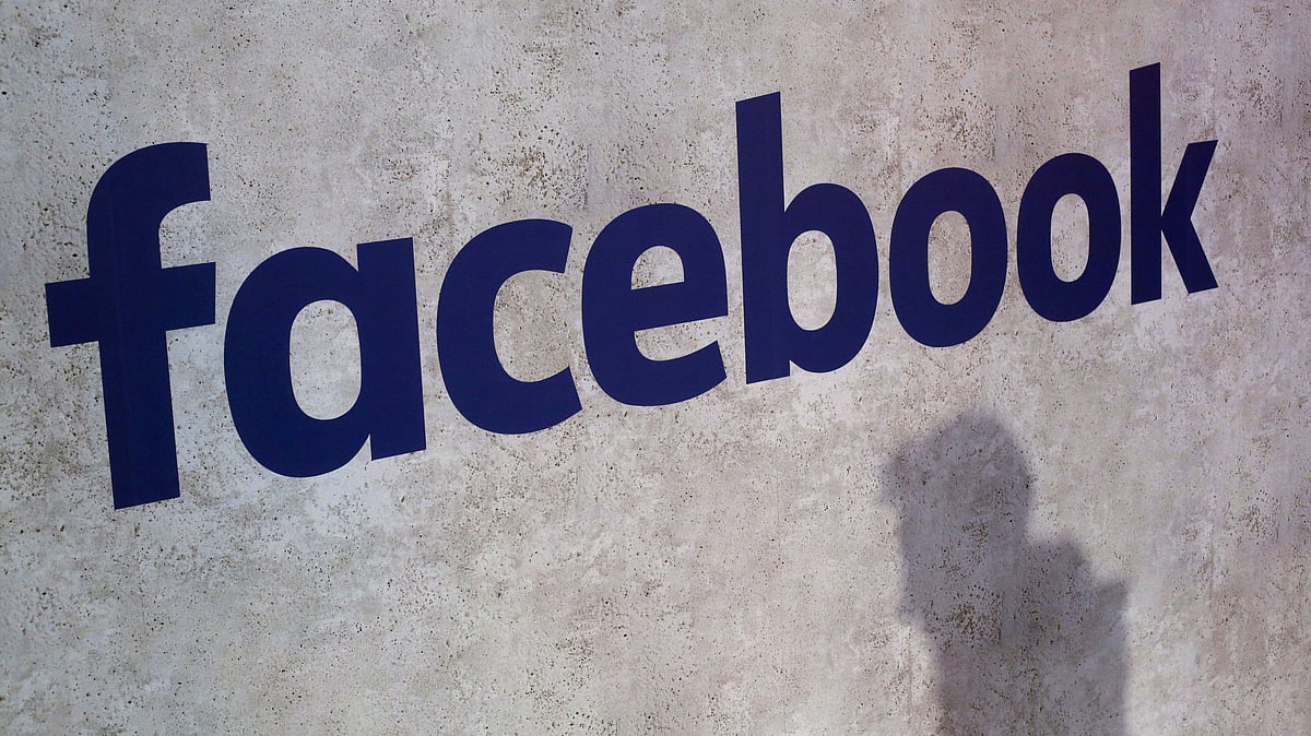 Facebook logo displayed at a business gathering in Paris