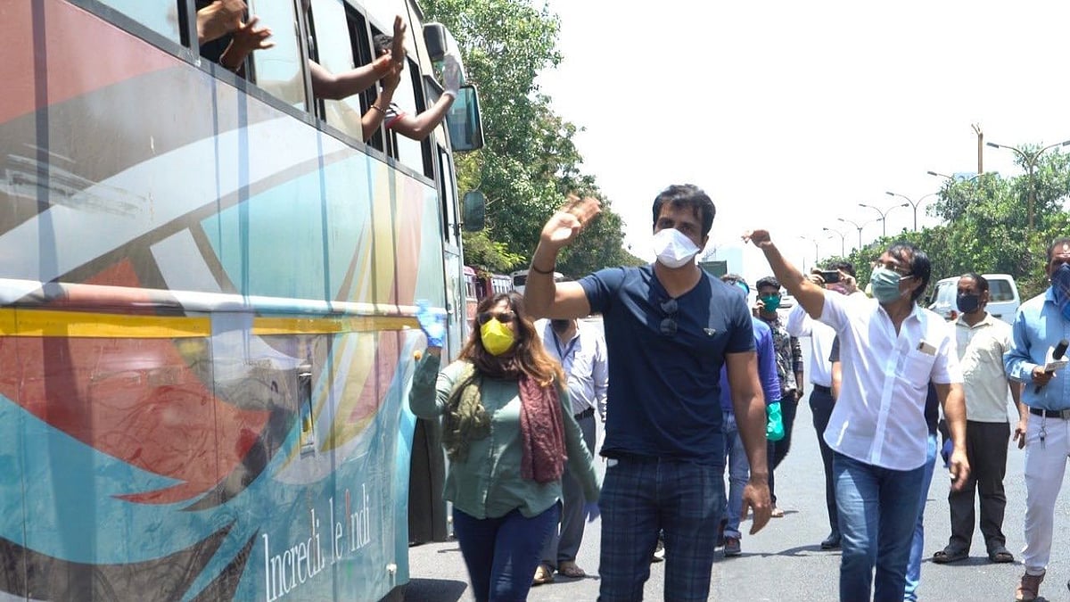 Sonu Sood getting migrants into buses so that they get home safely.