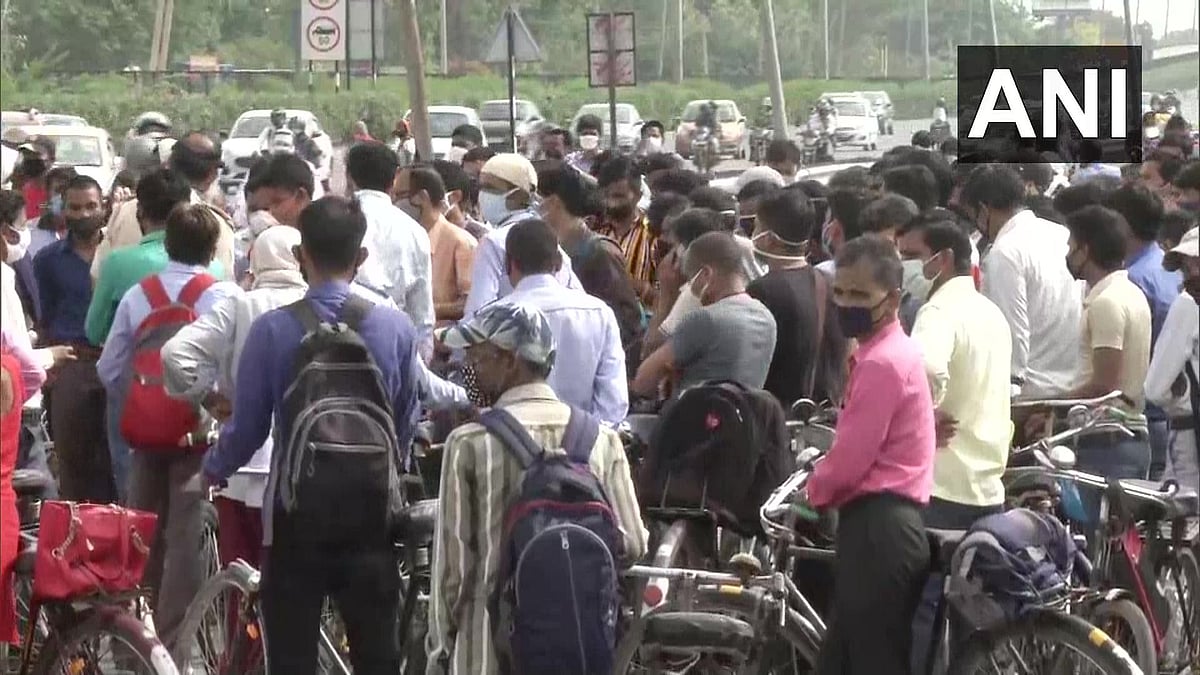 People in large numbers gather at Delhi-Gurugram border after Haryana Govt yesterday sealed borders with the national capital in wake of increasing number of COVID-19 cases.