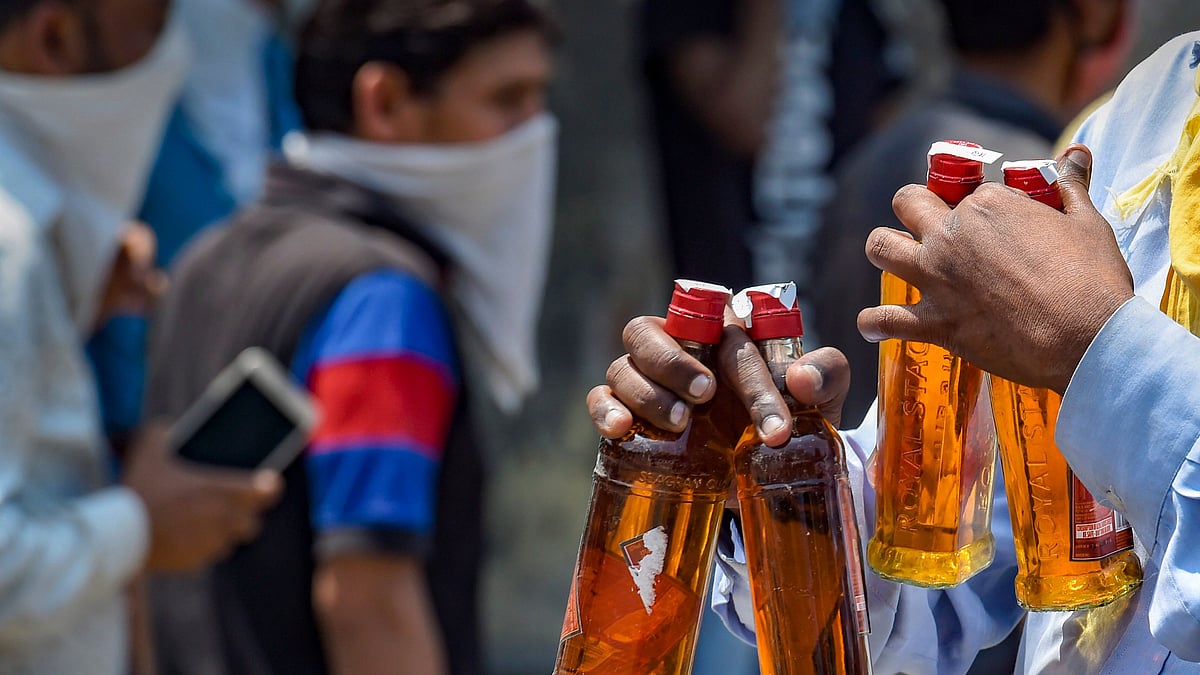 Long queues were witnessed outside liquor shops in Delhi despite imposition of 70 per cent as coronavirus fee on the sale of liquor.