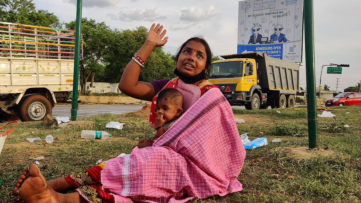 Jamuna, a migrant worker, along with her child. 