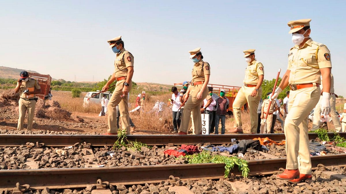 Police personnel inspect the spot after a goods train ran over a group of migrant workers while they were sleeping on the tracks, in Aurangabad.
