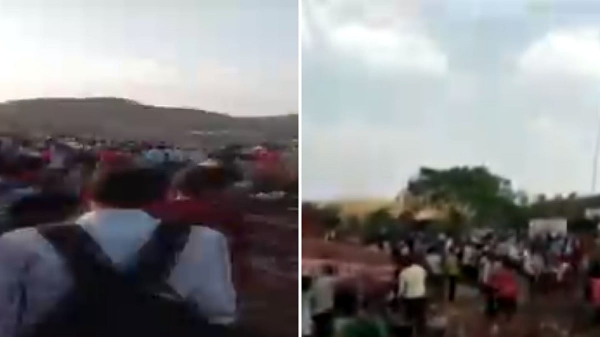 Migrants can be seen pelting stones, demanding for arrangement of buses to send them to their native places in Uttar Pradesh and Bihar.
