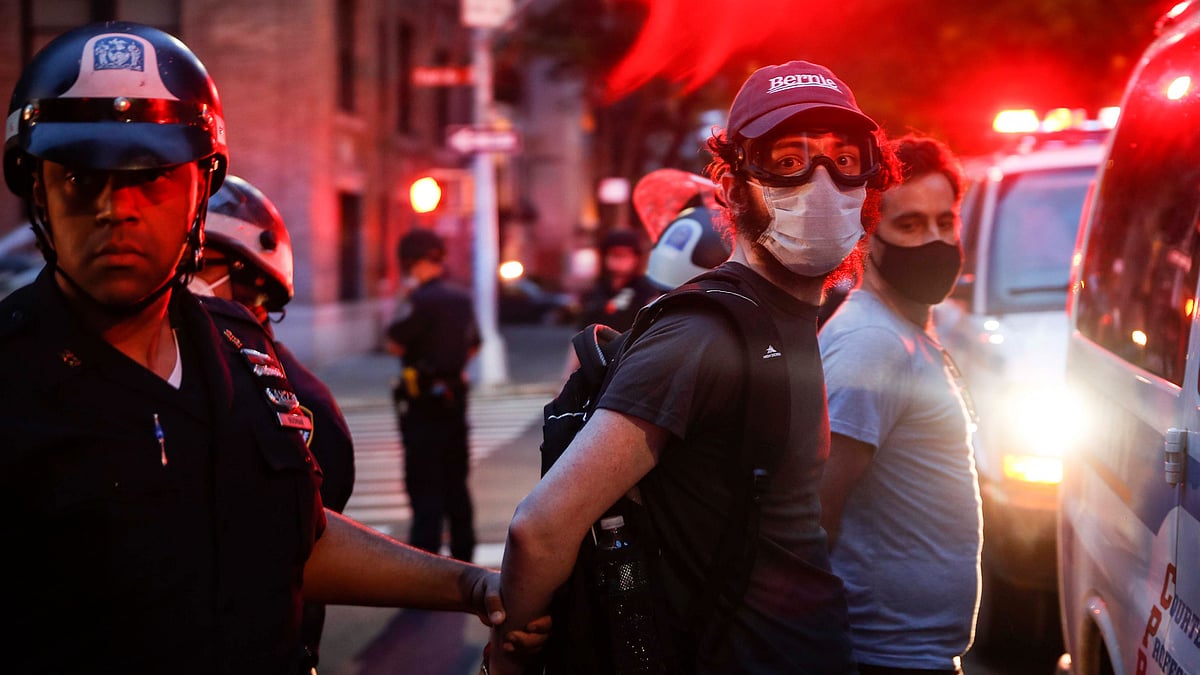 Protesters are arrested by NYPD officers on Park Avenue after violating curfew on Friday, 5 June in New York. Demonstrations continued Friday following the death of George Floyd who died after being restrained by Minneapolis police officers on May 25.