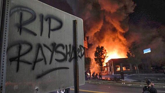 Protests simmered across Atlanta over the shooting of a African-American man, Rayshard Brooks.