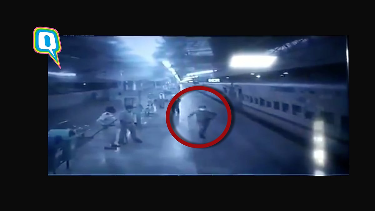RPF constable Inder Yadav running towards a moving train to deliver a packet of milk for an infant.