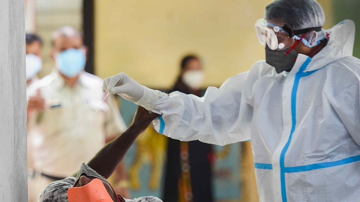 A medic collects samples for COVID-19 testing in New Delhi. Image used for representational purposes.&nbsp;