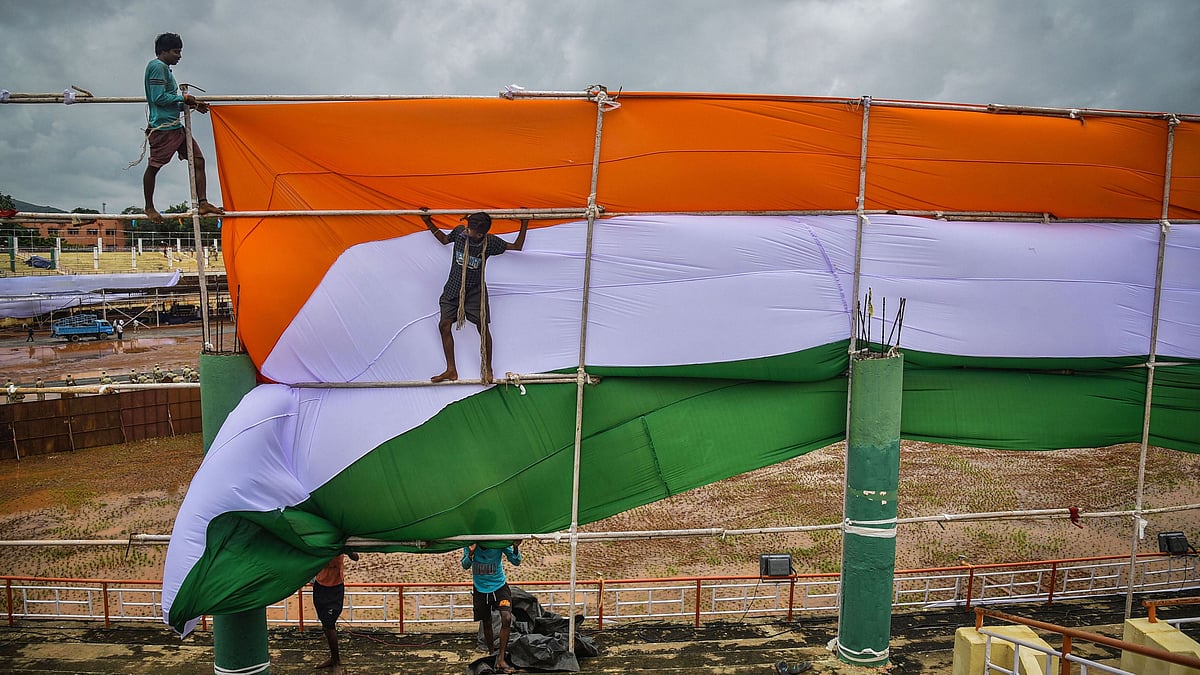 Workers busy in preparations for the upcoming 74th Independence Day celebrations, at Indira Gandhi Municipal Corporation Stadium in Vijayawada. &nbsp;