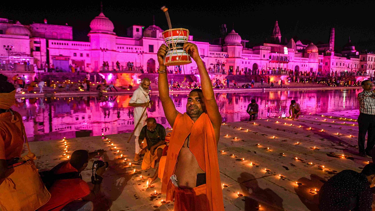 Devotees celebrate ‘Deepotsav’ at Ramghat on the eve of ‘bhoomi pujan’ of the Ram Temple, in Ayodhya on 4 August. 