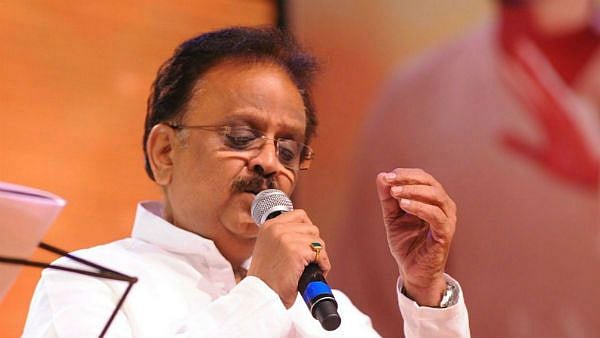 SP Balasubrahmanyam singing at a concert.