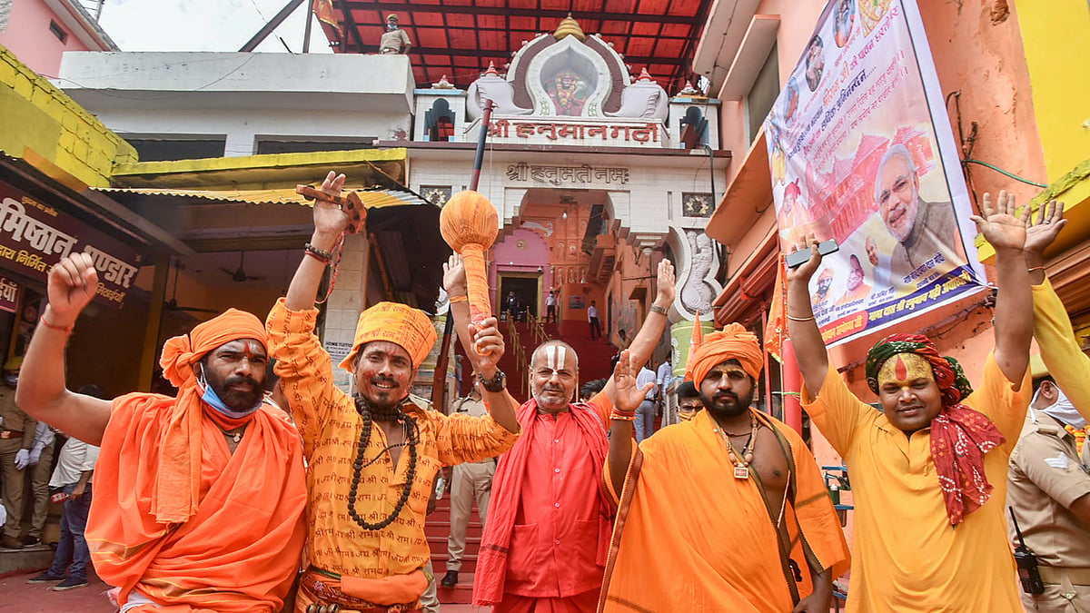 Sadhus celebrate the Bhoomi Pujan day for the construction of Ram Temple, at Hanuman Garhi in Ayodhya, Wednesday, 5 August.
