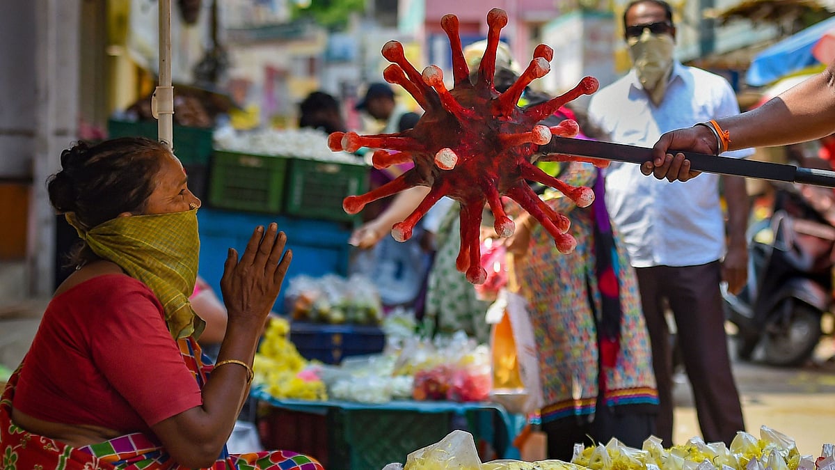 A policeman wearing a coronavirus-themed outfit walks at a market to raise awareness about social distancing, during a government-imposed nationwide lockdown as a preventive measure against COVID-19 in Chennai. Image used for representation.