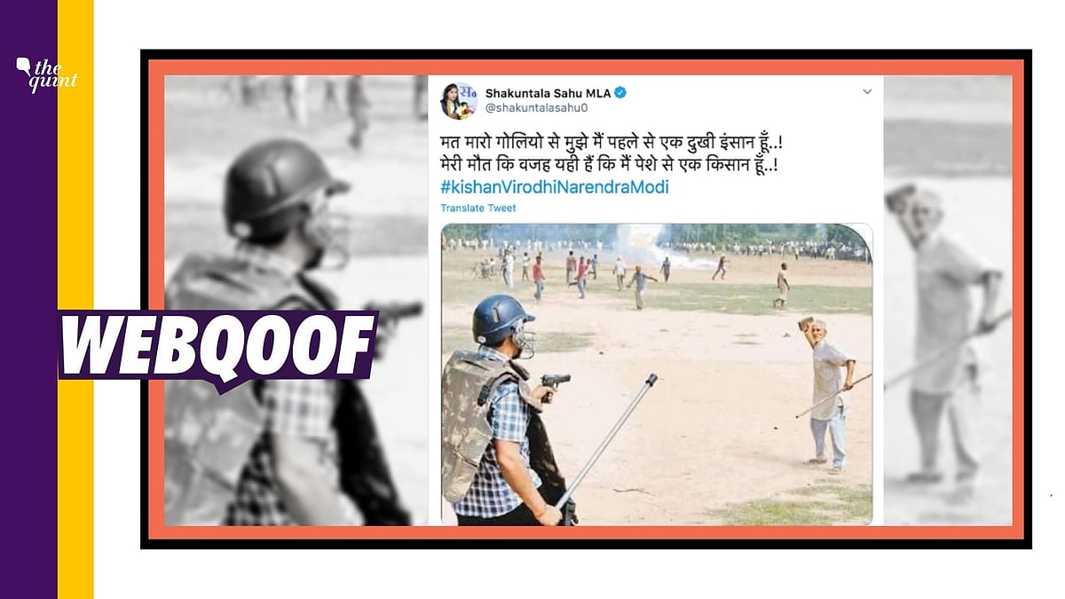 The image is from 2013 when an officer was trying to control villagers during a clash with police in Khera village of Meerut, Uttar Pradesh.