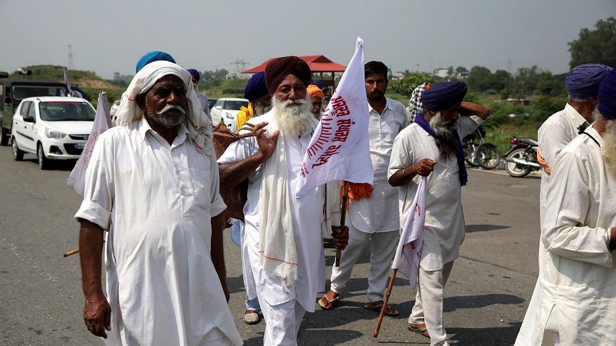 Farmers block vehicular movement across the Amritsar-Delhi national highway as they stage a demonstration against the Centre over its three agriculture ordinances. 