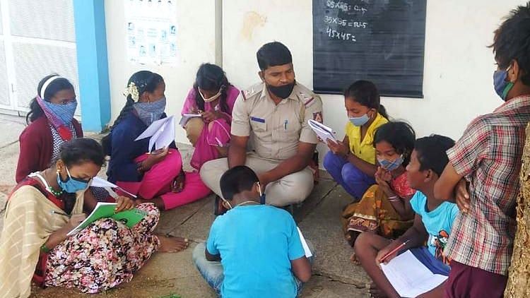 Police sub-inspector Shantappa Jadammanavar at a migrant settlement in Nagarbhavi in western Bengaluru.&nbsp;