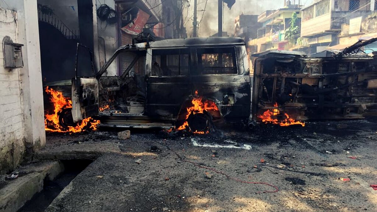 Mob set a police vehicle on fire in Munger
