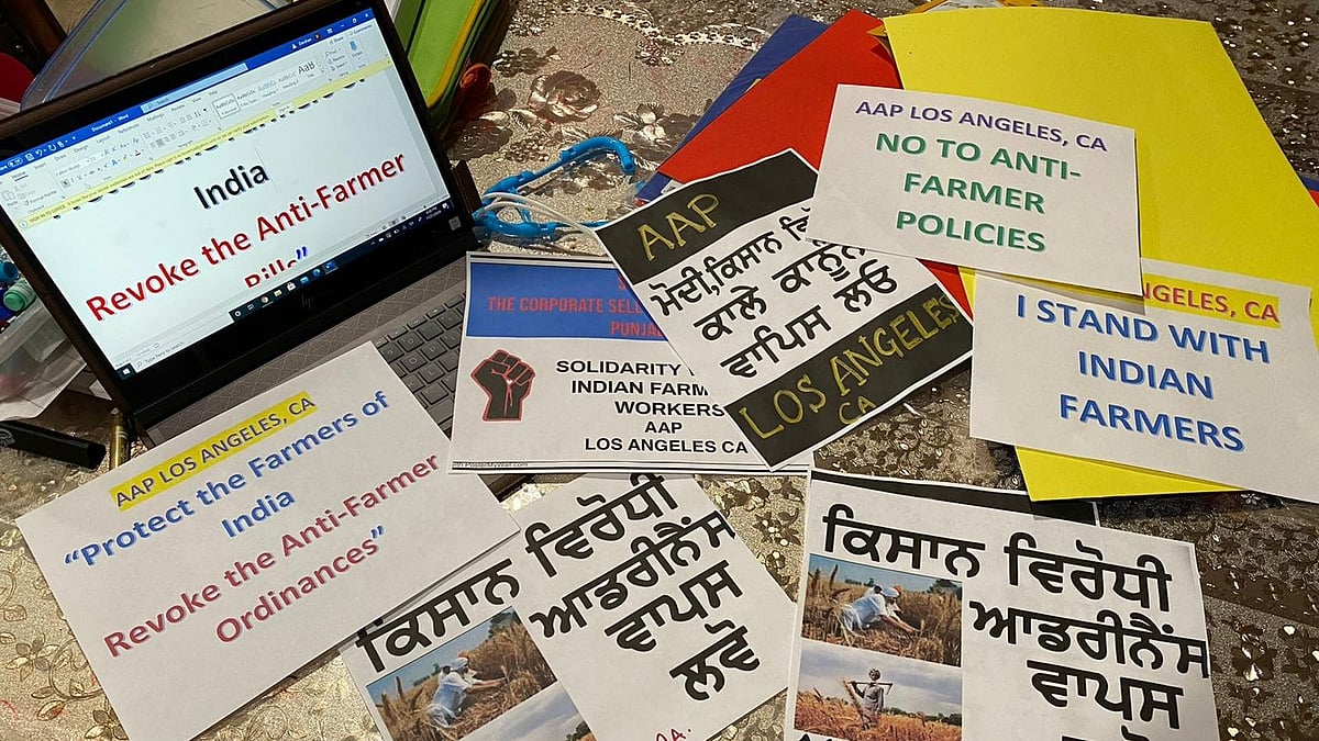 Diaspora in Los Angeles prepare to their banners to protest in solidarity for the rights of Indian farmers. 