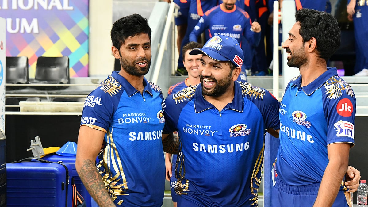 Suryakumar Yadav and Rohit Sharma celebrate with the Mumbai Indians team.&nbsp;