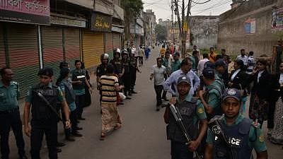 File photo from Dhaka of Bangladeshi policemen standing guard in front of a special court on 10 October 2018.
