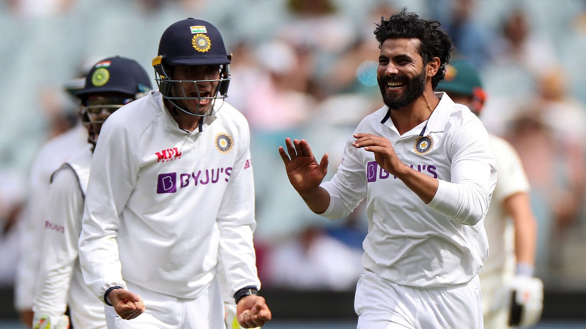 Shubman Gill and Ravindra Jadeja celebrate an Australian wicket in Melbourne. 
