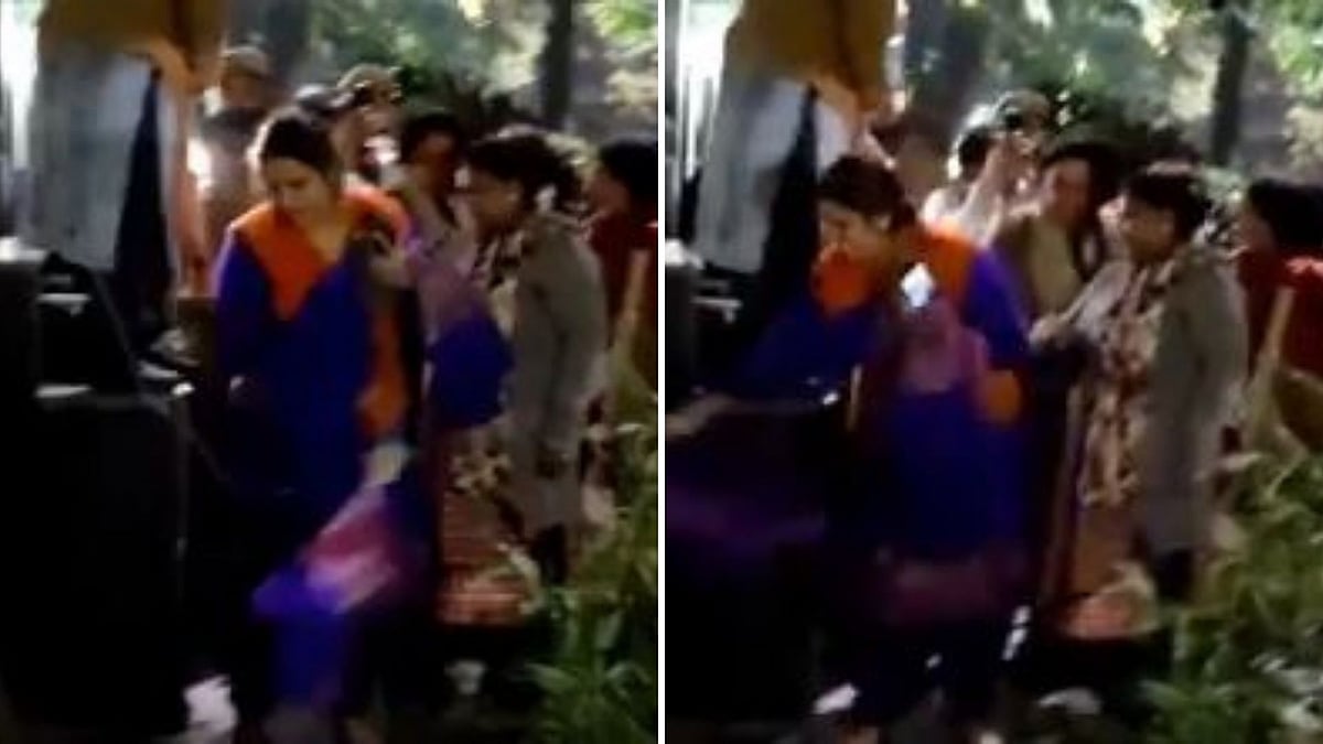 In a video shared by AAP’s official handle, a woman can be seen breaking the CCTV camera.