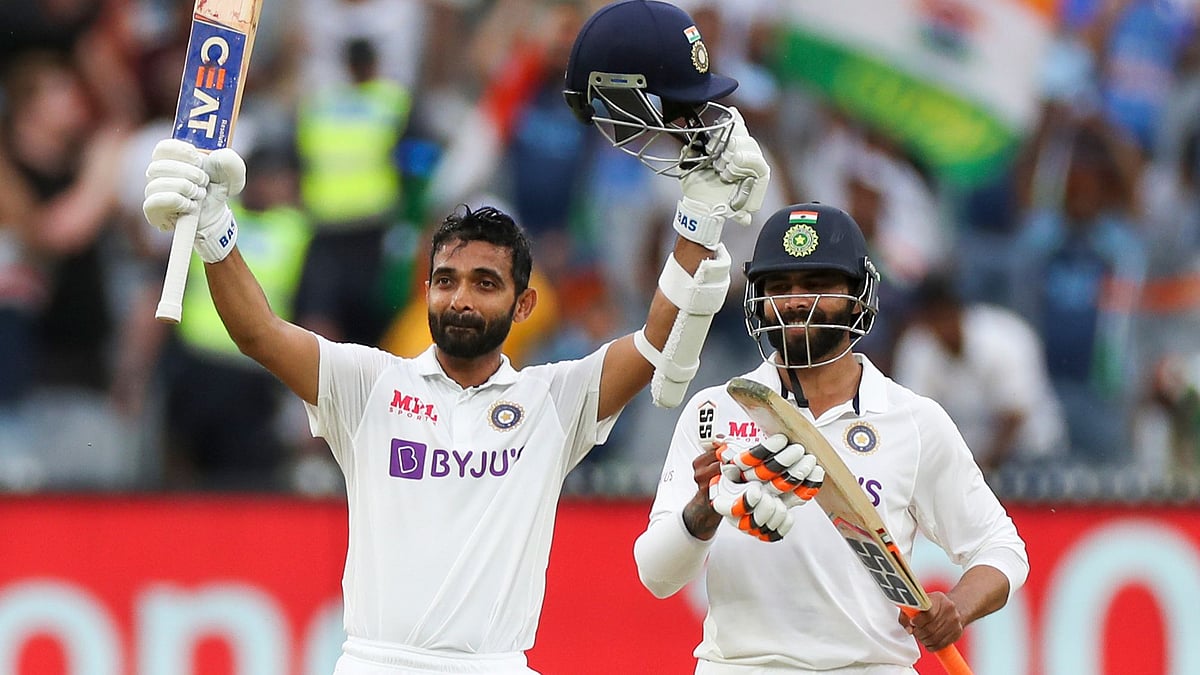 Ajinkya Rahane acknowledges the applause after completing his century on Day 2 of the Boxing Day Test in Melbourne. 