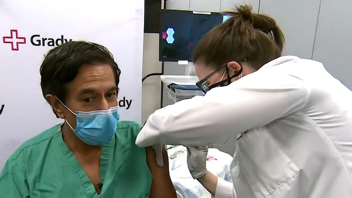 Indian-American Celebrity, Dr Sanjay Gupta receiving the COVID vaccine.