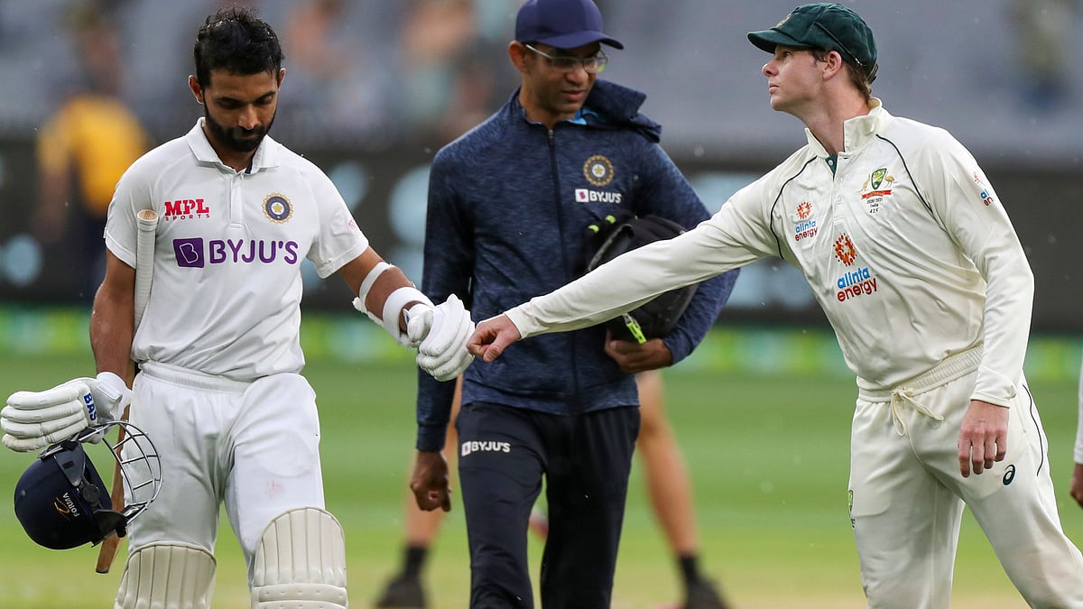 Ajinkya Rahane congratulated by Steve Smith after his century on Day 2 at Melbourne. 