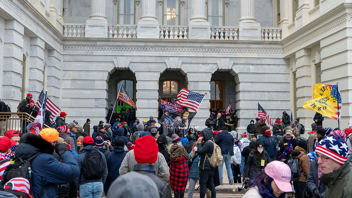 Supporters of President Donald Trump try to open a door of the U.S. Capitol on Wednesday, 6 January, 2021, in Washington.