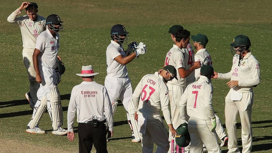 Australian and Indian players at the end of the Sydney Test. 