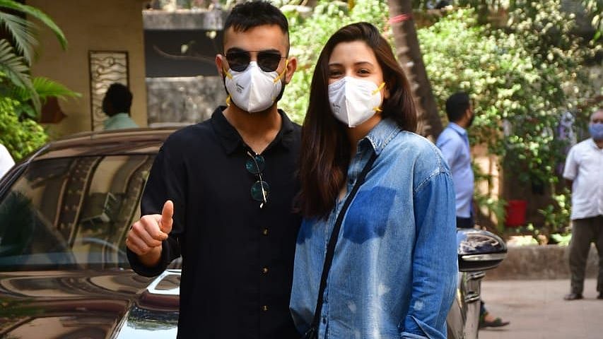 Virat Kohli and Anushka Sharma pose for a photograph. 